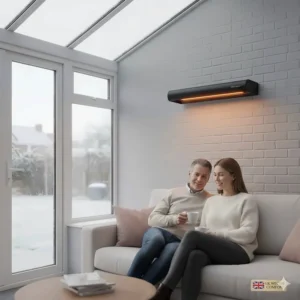 A wall-mounted bar infrared heater keeping a glass-roofed conservatory warm during a cold British winter.