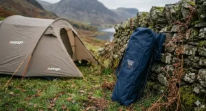 A lightweight, foldable heated camping chair being packed into a compact car boot.