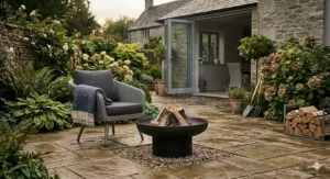 A durable cast iron fire bowl for garden use, shown on a stone terrace.