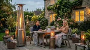 A portable gas patio heater with integrated wheels for easy movement in the garden.