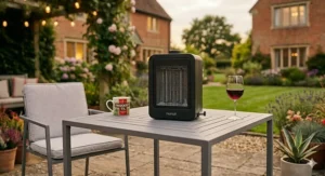 A sleek, contemporary small patio heater for table set on a minimalist metal garden table.