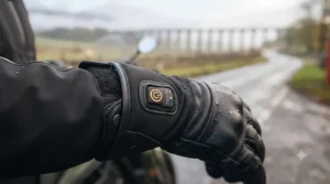 Close-up of temperature control settings on heated motorcycle gloves for cold hands