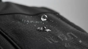 Close-up of water droplets beading on the surface of the durable, water-resistant fabric of a trade heated gilet.