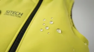 Close-up of water-resistant fabric texture on the hi-vis gilet.