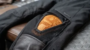 Adjustable zipped ankles on waterproof heated motorcycle trousers designed to fit snugly over touring boots.
