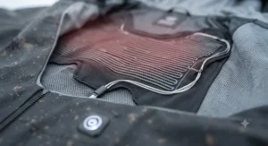 Diagram showing the chest and back carbon fibre heating panel zones inside a winter cycling jacket.