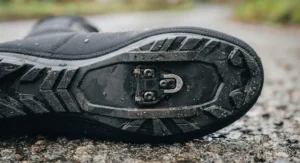 Reinforced sole cutout on heated cycling overshoes designed for standard road and MTB cleats.