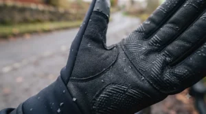 Anti-slip silicone palm grip and reflective safety strips on a pair of winter cycling gloves.