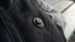 Close-up of the multi-level temperature controller on a heated motorcycle vest for touring.