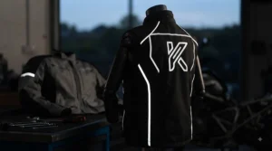 Reflective safety piping and accents on a heated motorcycle vest for touring in low-light conditions.