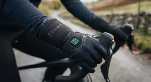 Close-up of a rechargeable battery indicator on heated cycling gloves for road cyclists showing multiple heat settings.