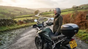 A touring motorcycle parked on a frosty British country lane, ready for a cold-weather ride with heated grips installed.