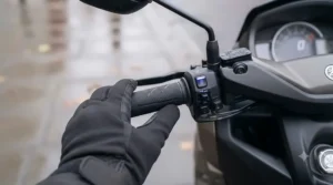 Weatherproof handlebar control switch showing multiple heat settings for scooter heated grips.