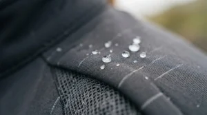 Water-resistant and windproof fabric detail on a heated cycling jacket designed for unpredictable UK weather.