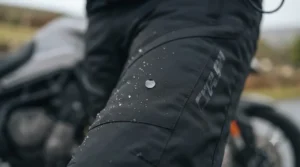 Water-resistant outer shell fabric on winter heated motorcycle trousers designed to withstand wet British weather.