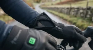 Extended windproof cuff on heated cycling gloves for road cyclists tucked securely under a winter jersey sleeve.