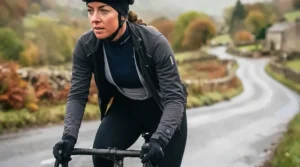 Cyclist wearing a lightweight heated cycling jacket layered over a thermal jersey for cold-weather training.