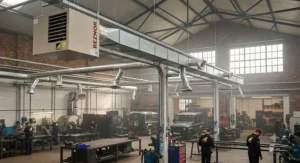 A ducted warm-air gas heating system distributing heat evenly across a spacious commercial garage.