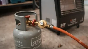 Connecting a propane gas bottle to a portable garage heater.