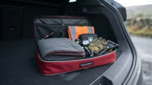 A 12V heated car blanket packed as part of a winter car emergency breakdown kit for freezing weather